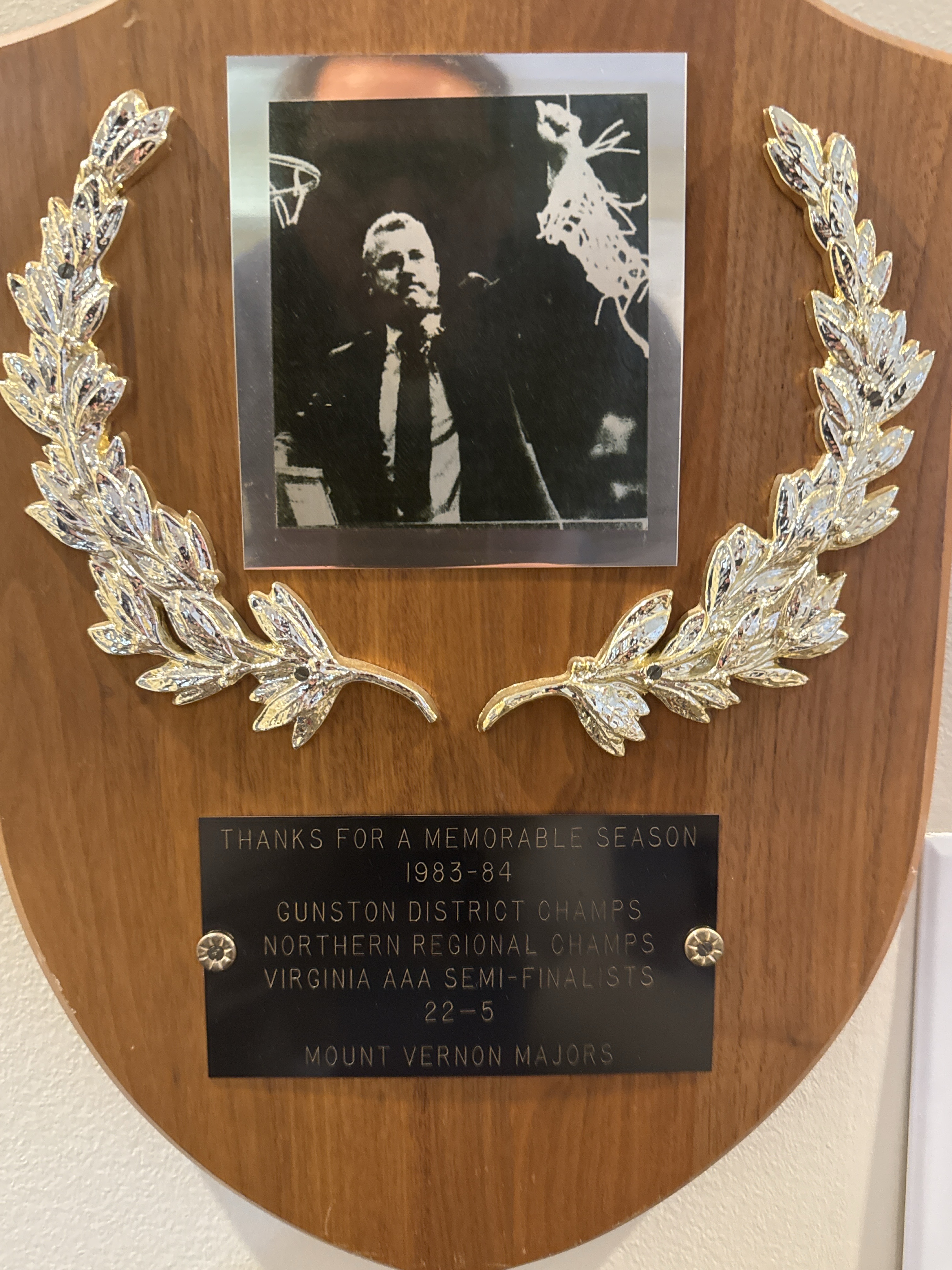 1983-84 Mount Vernon championship plaque with photo of Coach McCool cutting down the net.